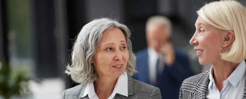 Two businesswomen looking at each other